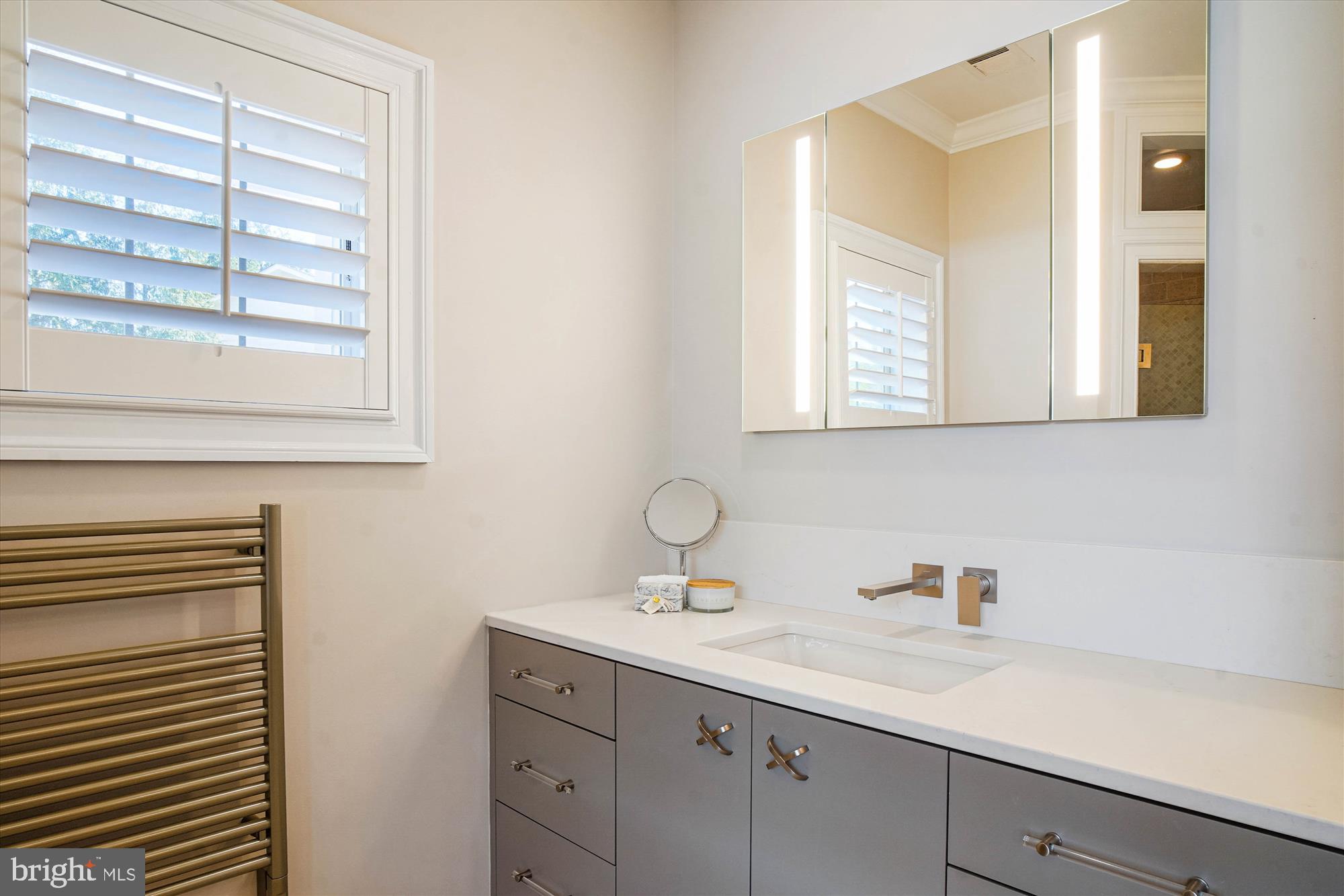 6603 Pyle Road Bethesda, MD 20817 - Photo 47 of 91 a bathroom with a sink and a mirror