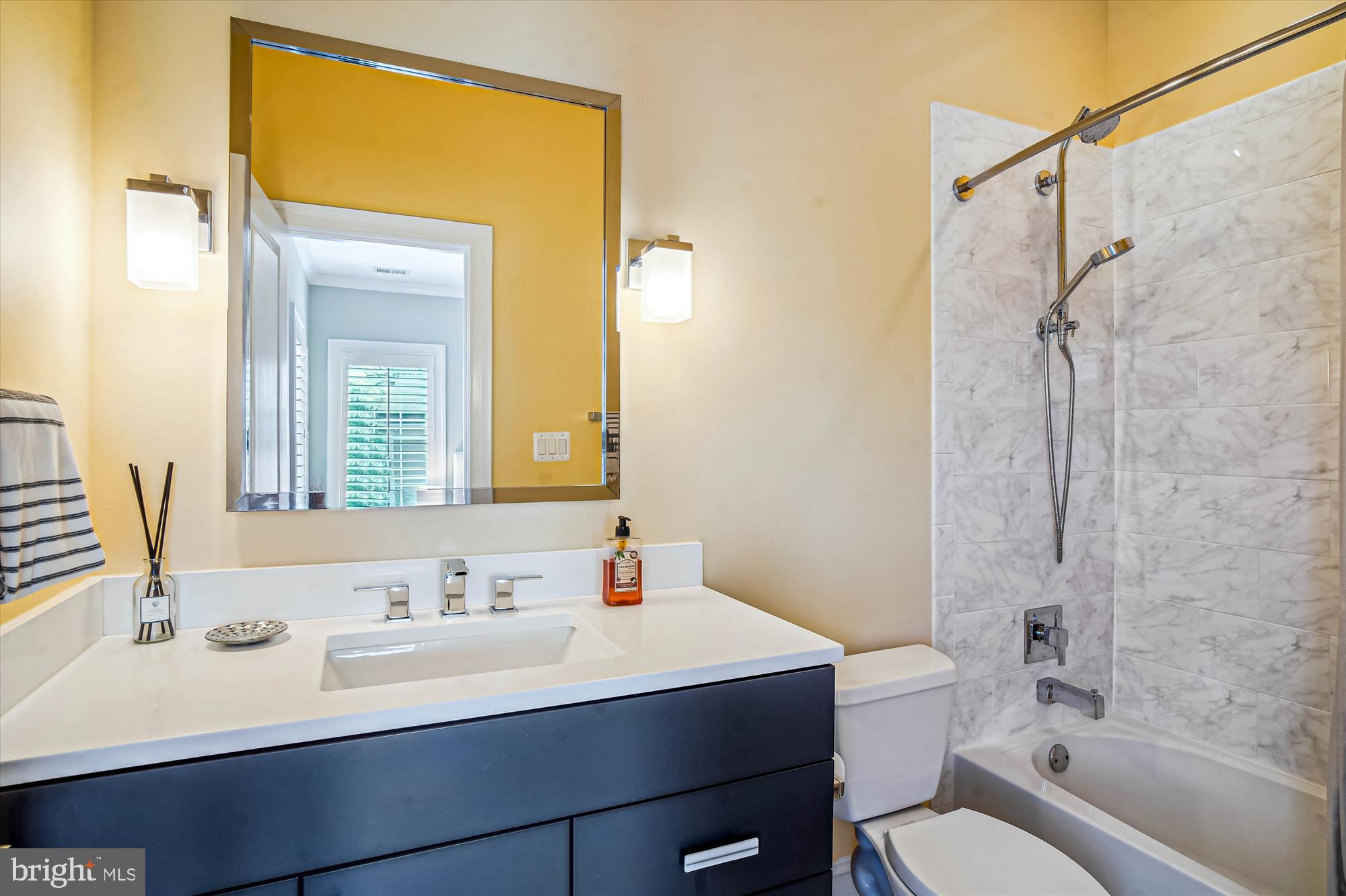 6603 Pyle Road Bethesda, MD 20817 - Photo 55 of 91 a bathroom with a sink vanity mirror and toilet