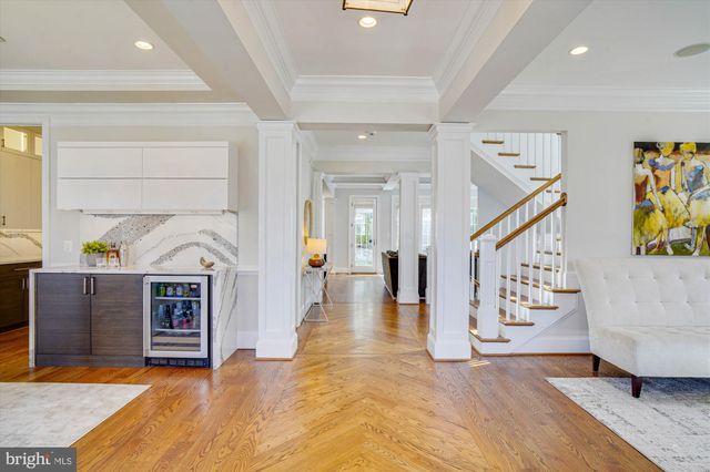 a view of a dining room with furniture wooden floor and chandelier