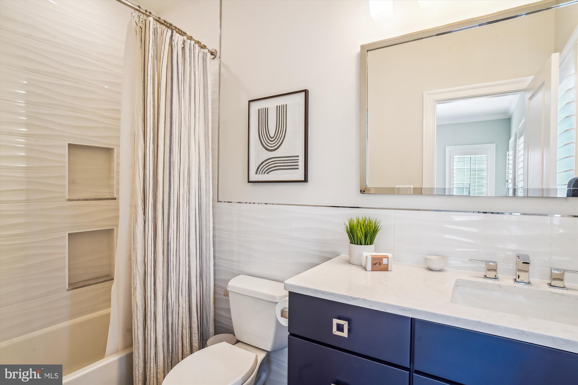 6603 Pyle Road Bethesda, MD 20817 - Photo 63 of 91 a bathroom with a granite countertop sink and a mirror
