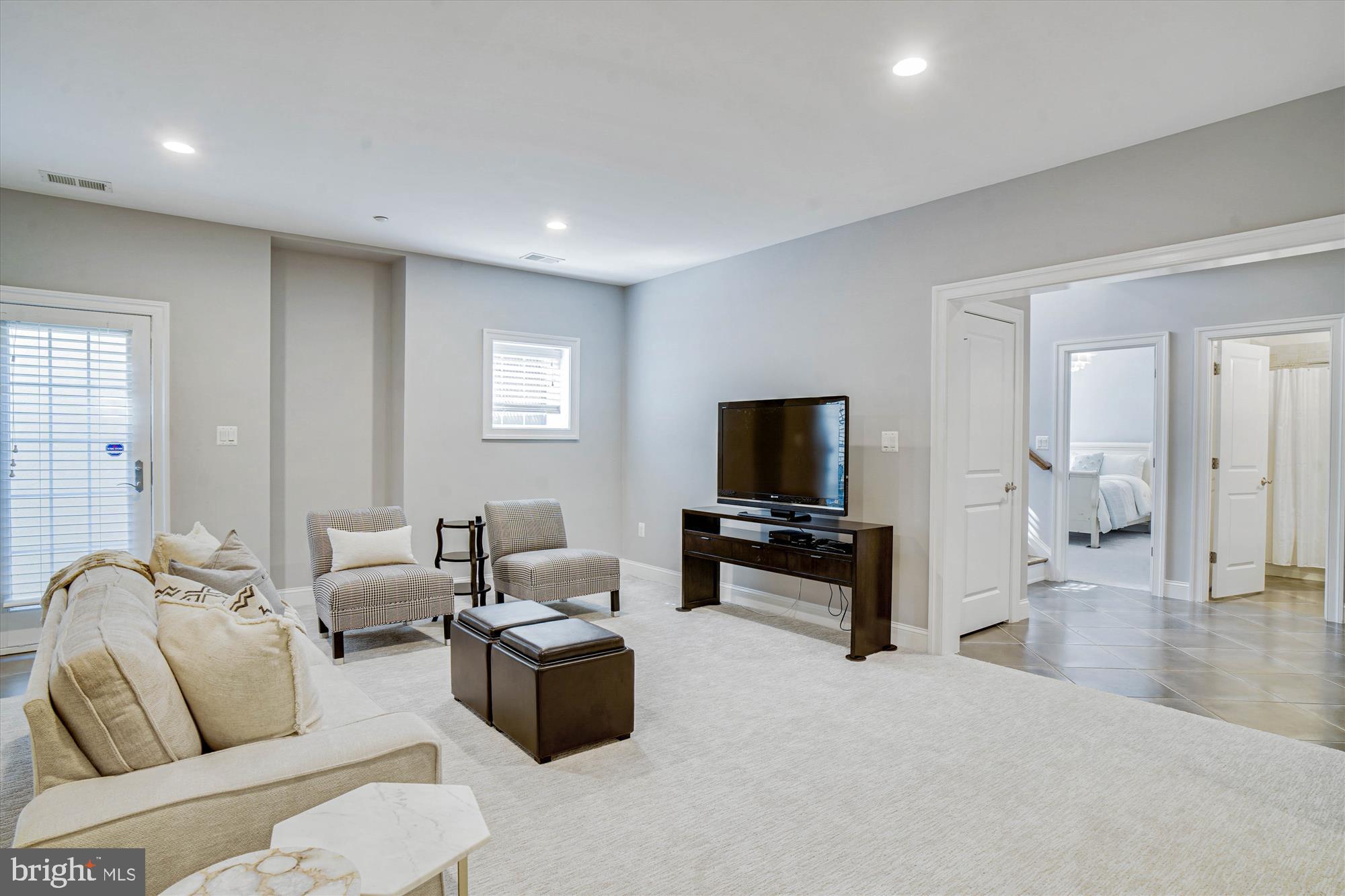 6603 Pyle Road Bethesda, MD 20817 - Photo 74 of 91 a living room with furniture and a flat screen tv