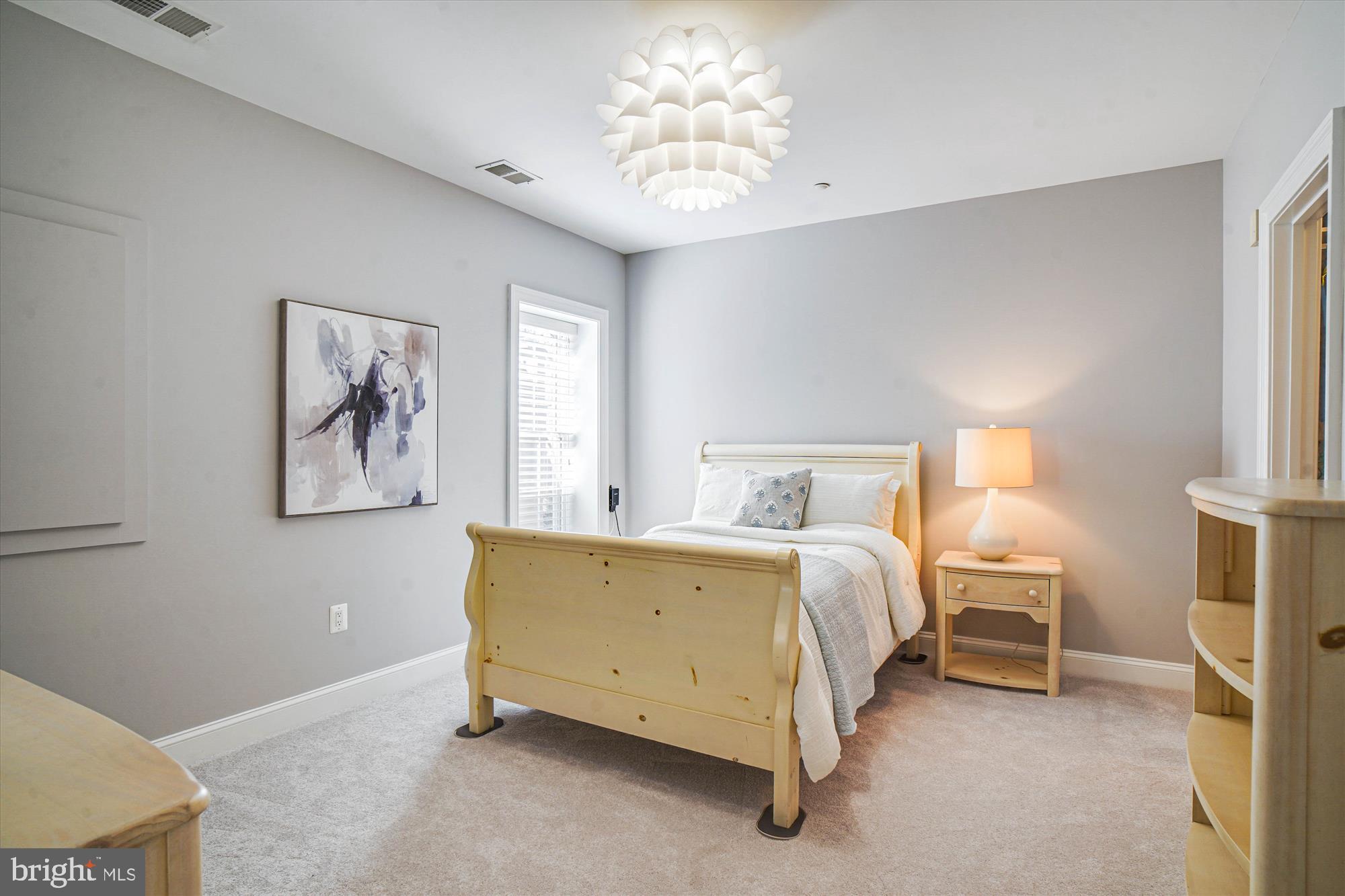 6603 Pyle Road Bethesda, MD 20817 - Photo 79 of 91 a spacious bedroom with a bed and a window