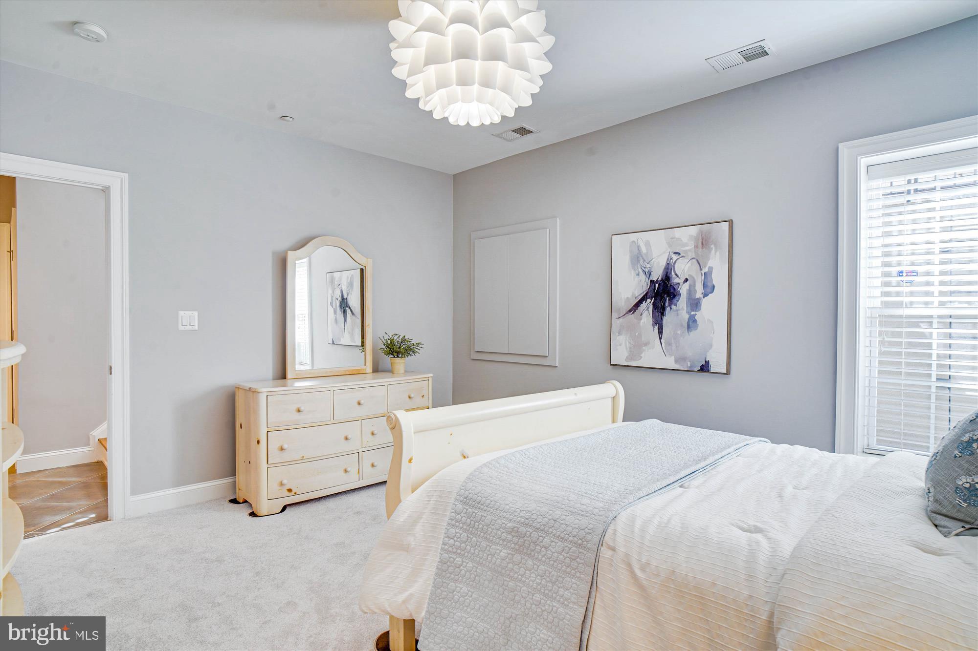 6603 Pyle Road Bethesda, MD 20817 - Photo 80 of 91 a bedroom with a bed and a chandelier