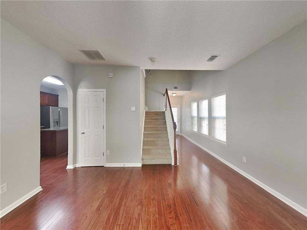 2157 Capella Circle Southwest Atlanta, GA 30331 - Photo 2 of 16 an empty room with wooden floor and windows