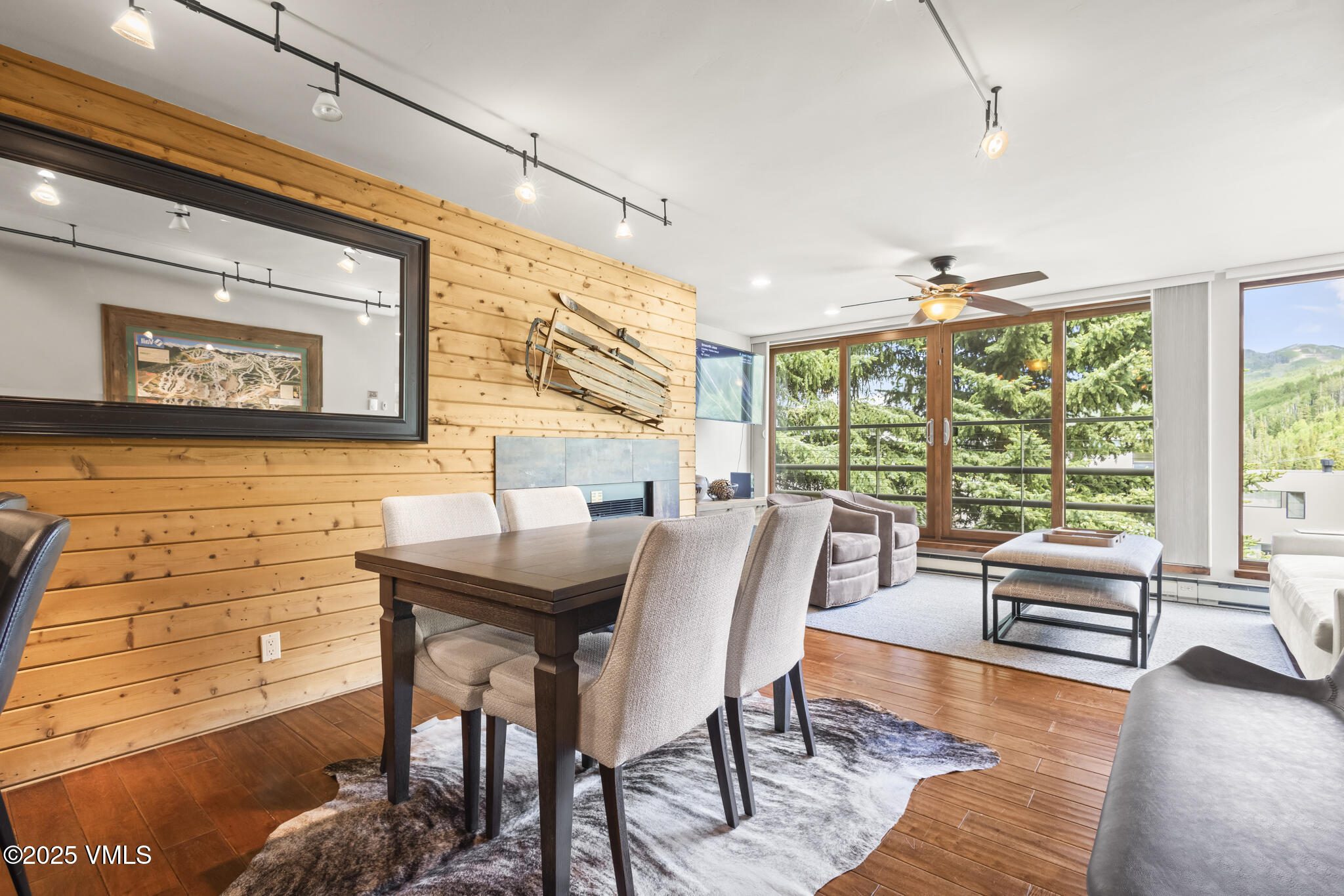 1100 North Frontage Road West, Unit 2504 Vail, CO 81657 - Photo 12 of 35 a view of a dining room with furniture wooden floor and a large window