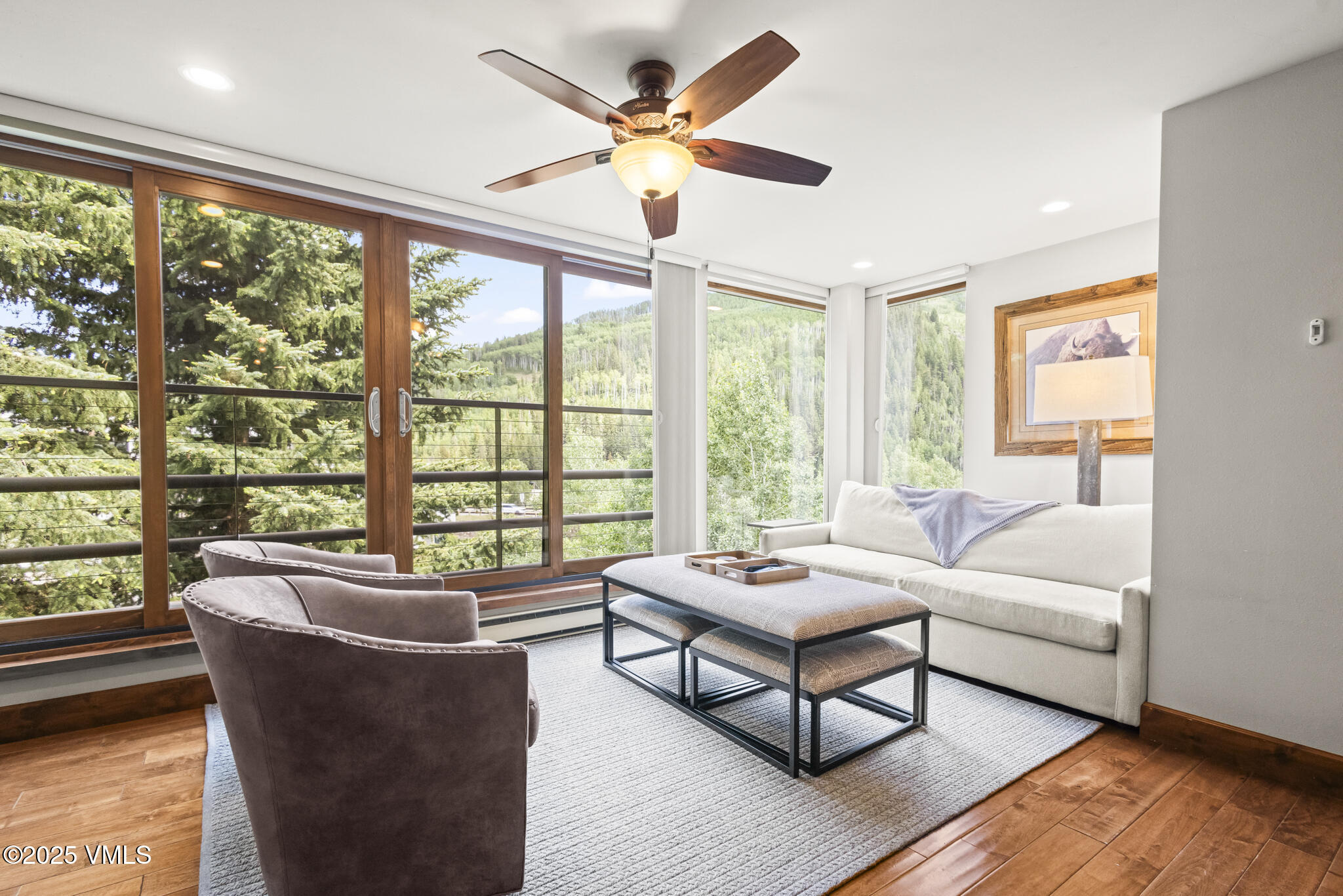1100 North Frontage Road West, Unit 2504 Vail, CO 81657 - Photo 15 of 35 a living room with furniture and a large window