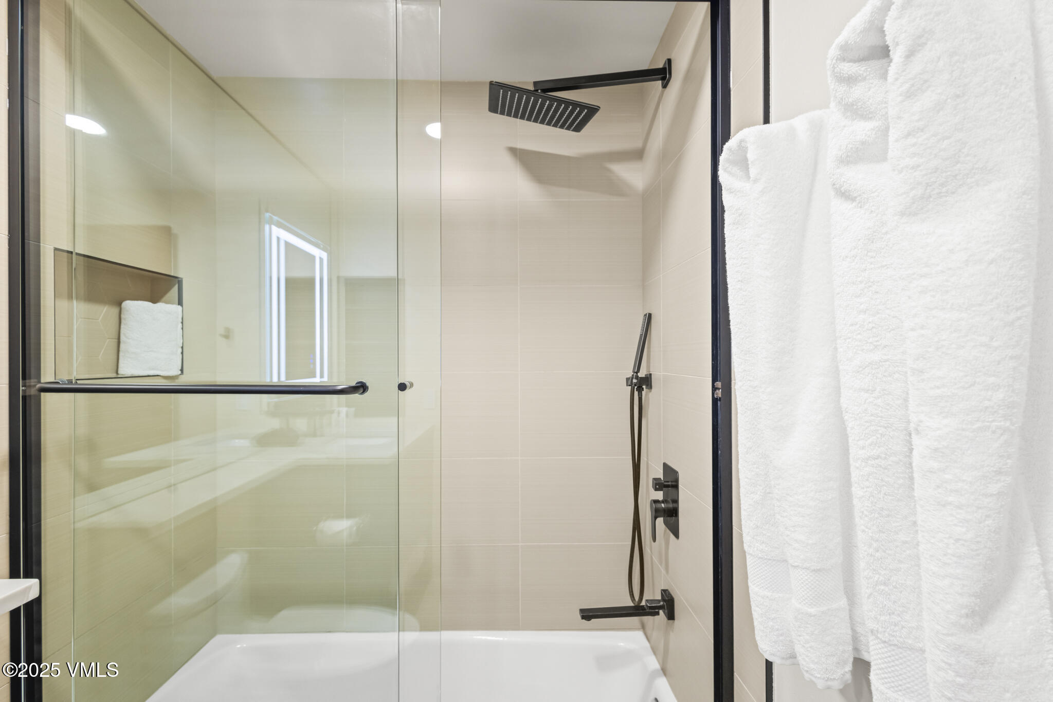 1100 North Frontage Road West, Unit 2504 Vail, CO 81657 - Photo 25 of 35 a bathroom with a glass shower door