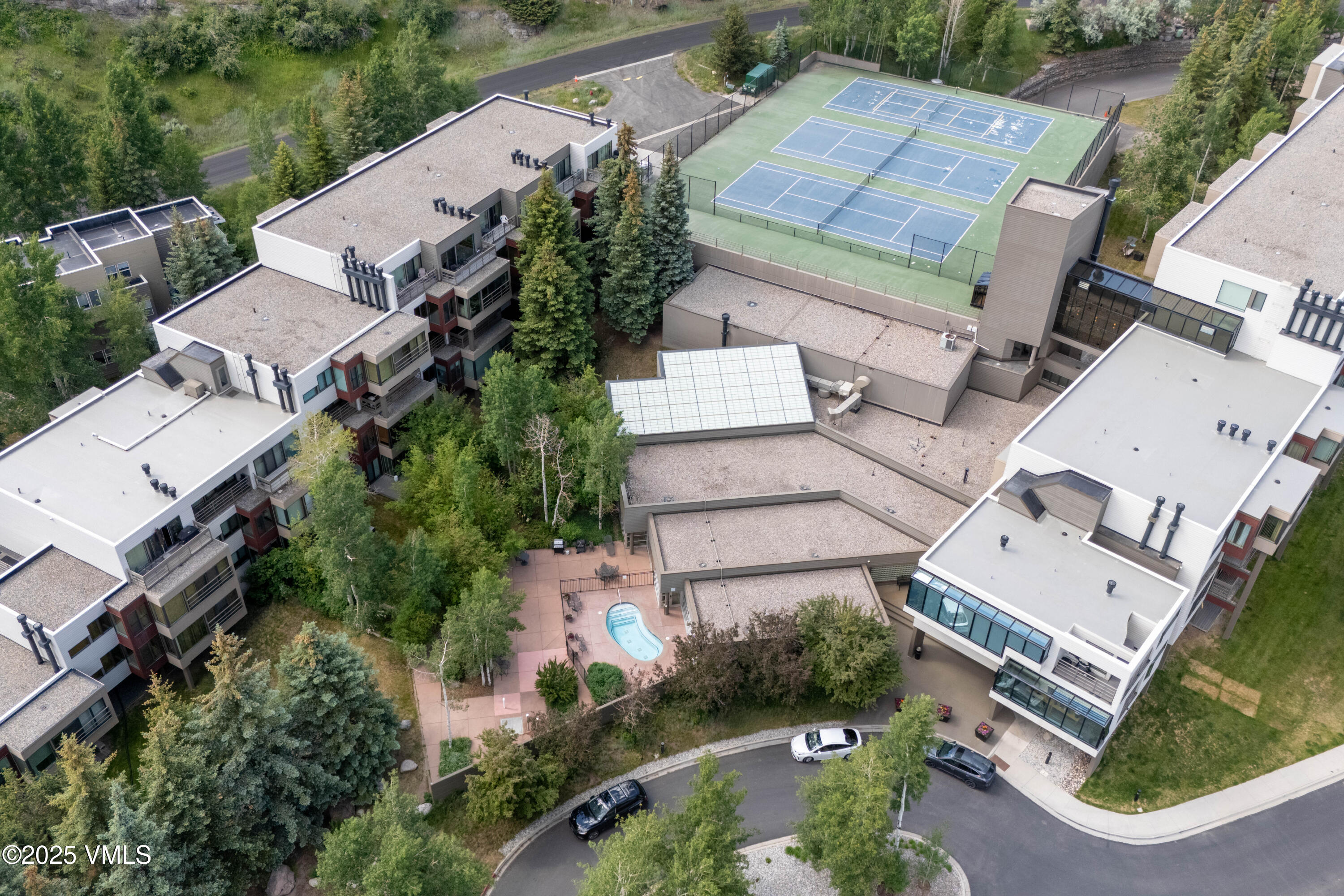 1100 North Frontage Road West, Unit 2504 Vail, CO 81657 - Photo 30 of 35 an aerial view of multiple houses with yard
