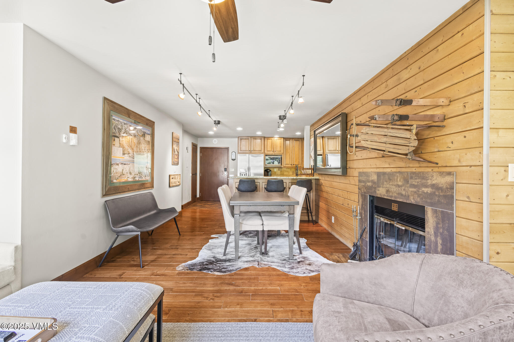 1100 North Frontage Road West, Unit 2504 Vail, CO 81657 - Photo 9 of 35 a living room with furniture a fireplace and a table