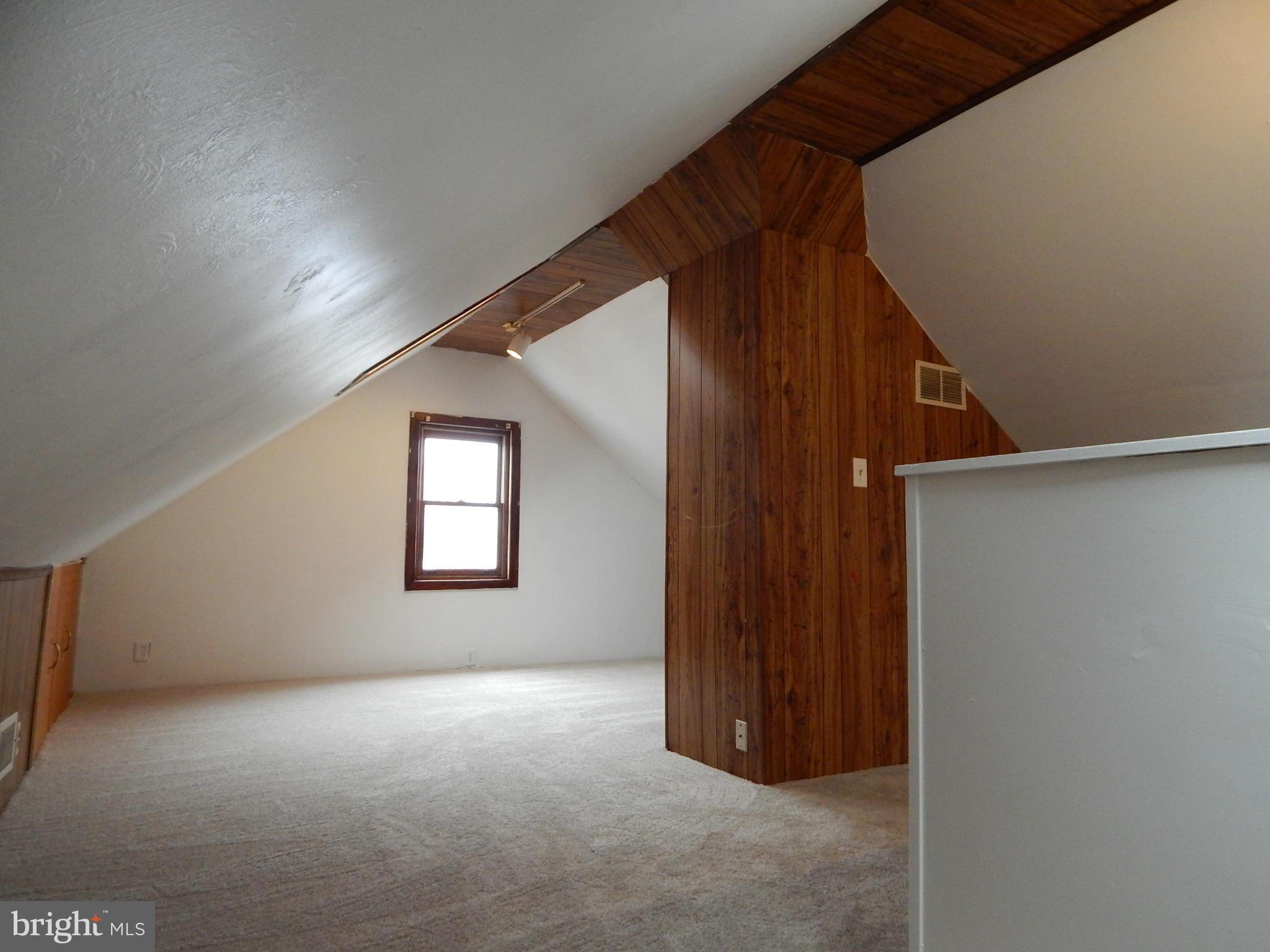 19 Riverside Road Essex, MD 21221 - Photo 11 of 16 a view of an empty room with a window
