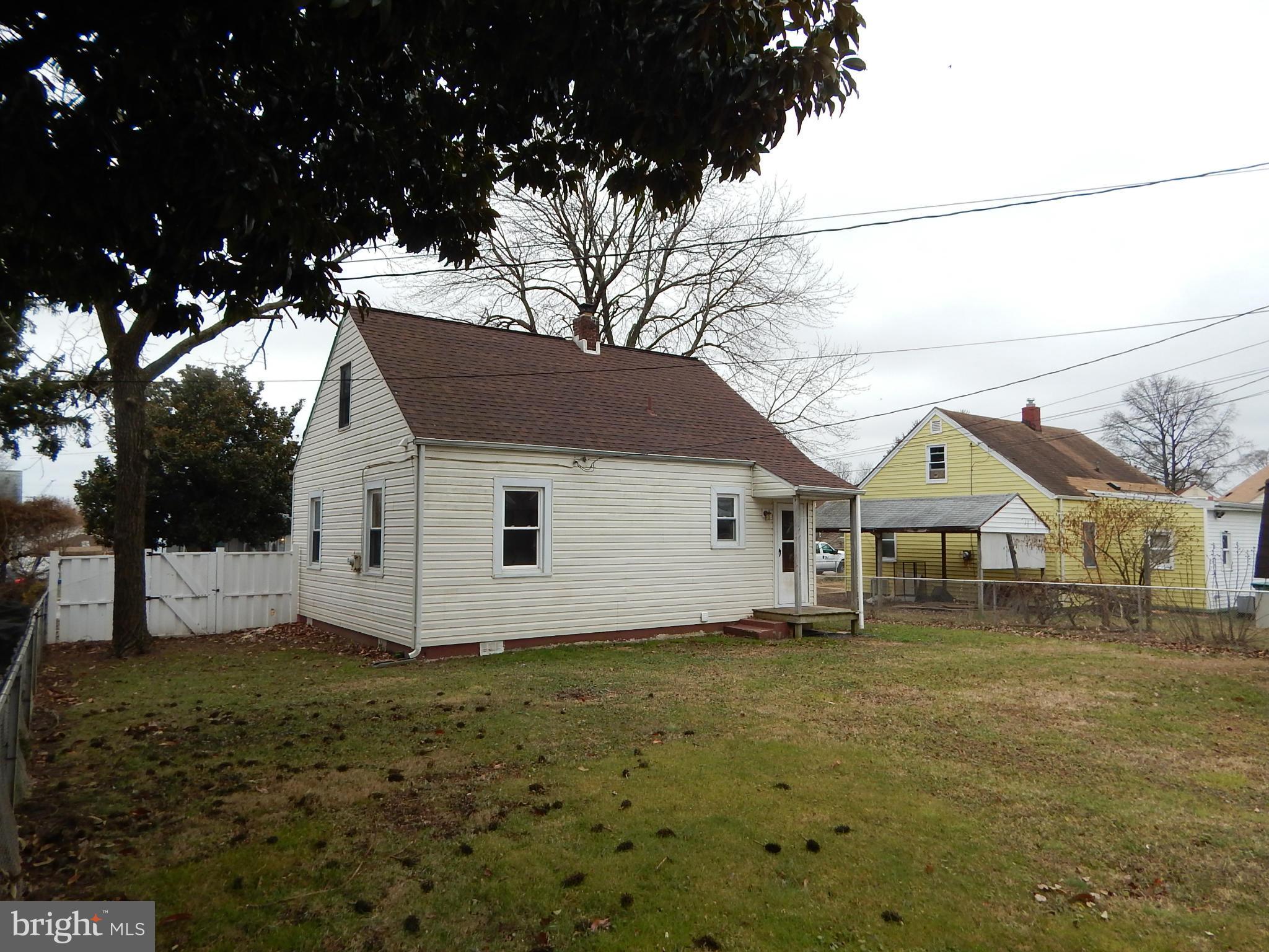 19 Riverside Road Essex, MD 21221 - Photo 16 of 16 a house with trees in the background