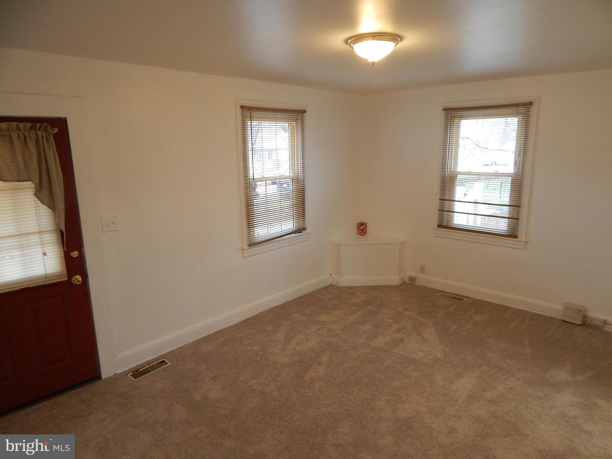 19 Riverside Road Essex, MD 21221 - Photo 3 of 16 an empty room with windows