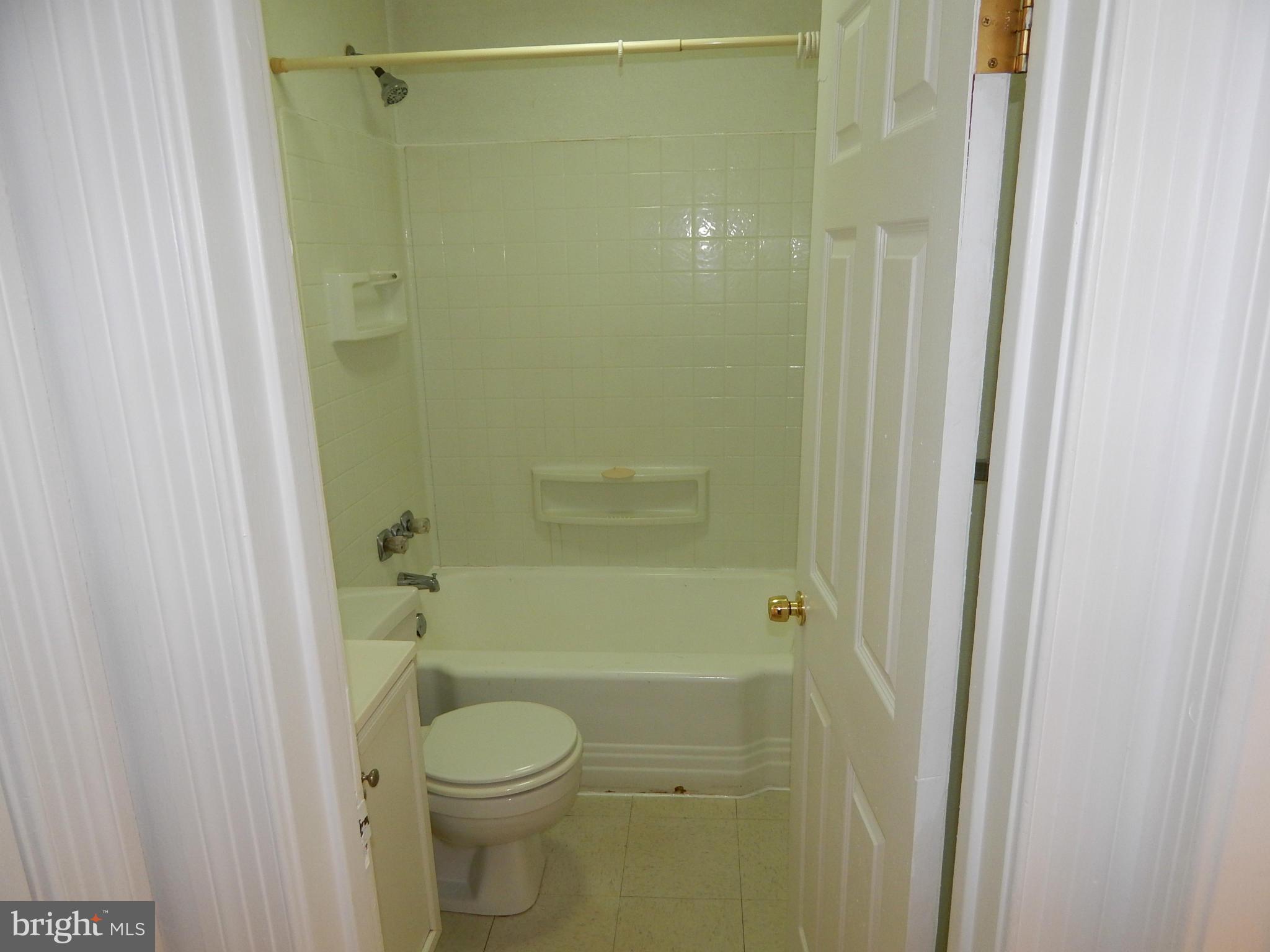 19 Riverside Road Essex, MD 21221 - Photo 4 of 16 a bathroom with a toilet and a shower