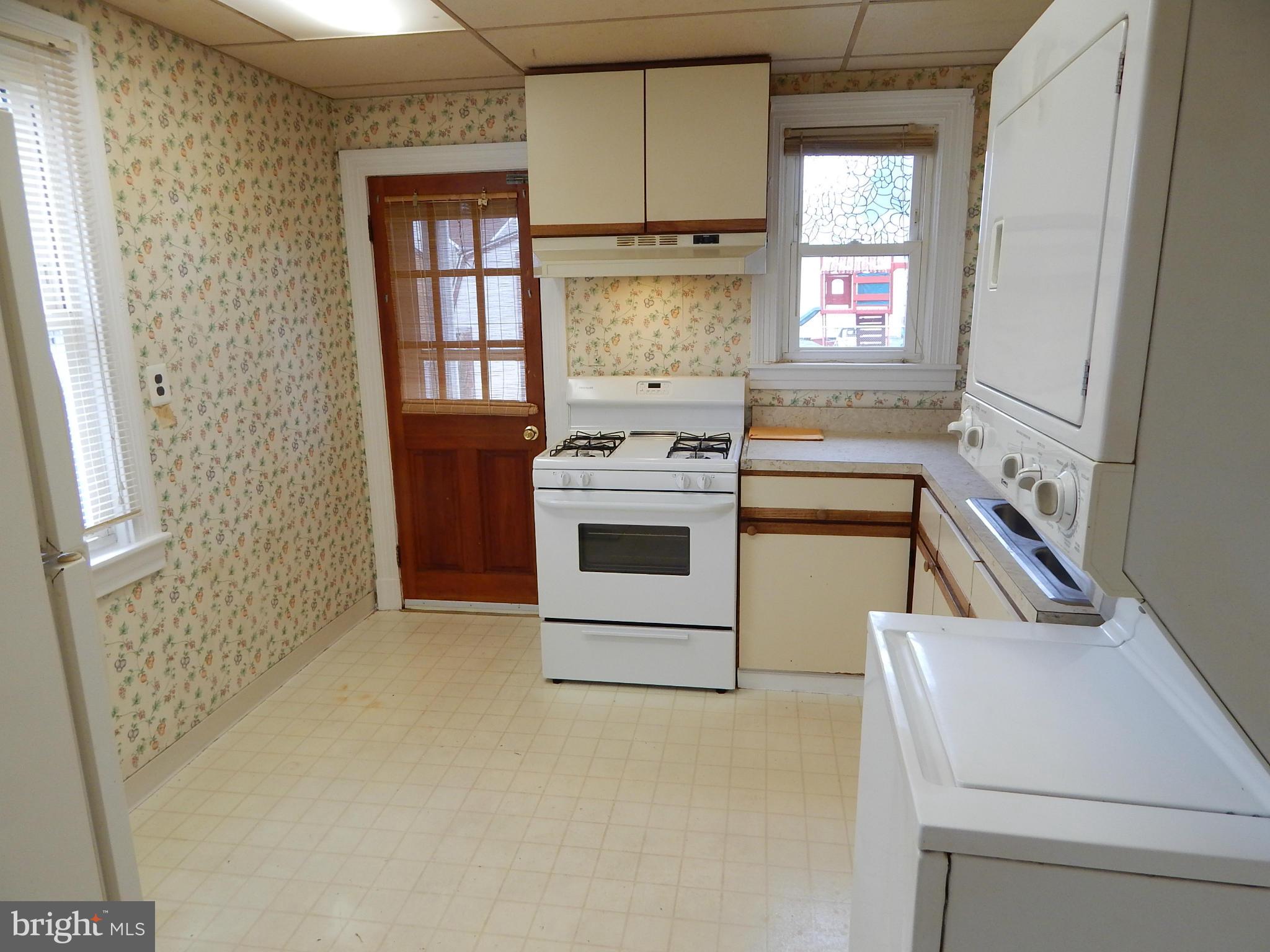 19 Riverside Road Essex, MD 21221 - Photo 8 of 16 a kitchen with a stove and a refrigerator