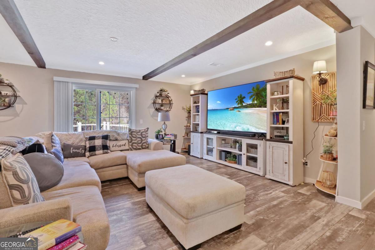 2505 Odum Road South Screven, GA 31560 - Photo 15 of 55 a living room with furniture flat screen tv and a large window