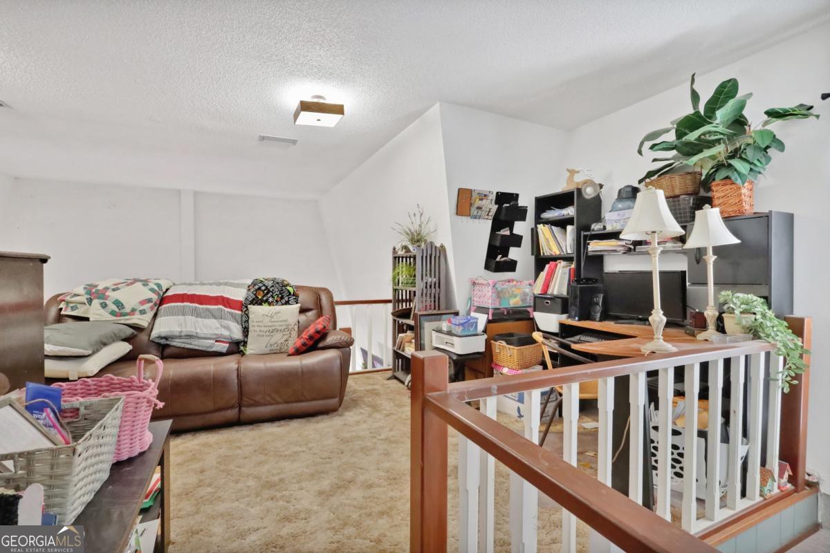 2505 Odum Road South Screven, GA 31560 - Photo 20 of 55 a bedroom with furniture and a chandelier