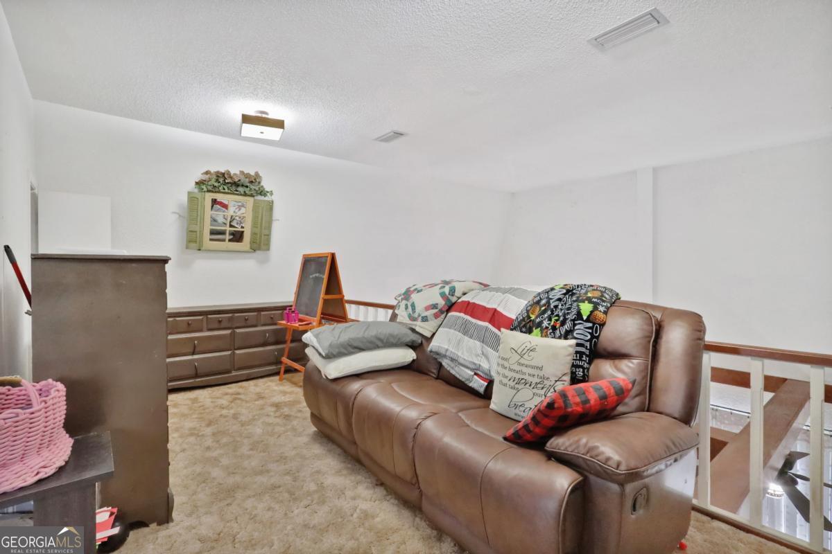 2505 Odum Road South Screven, GA 31560 - Photo 21 of 55 a living room with furniture and a couch