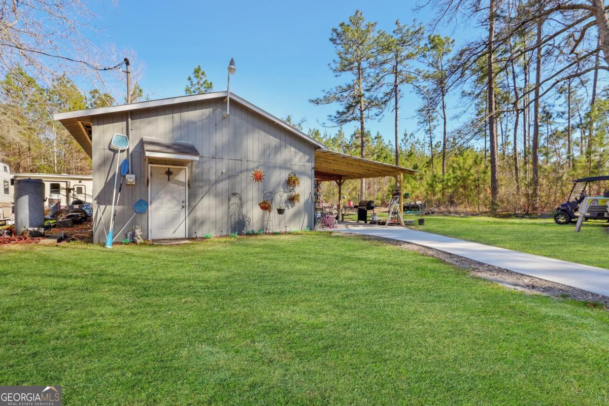 2505 Odum Road South Screven, GA 31560 - Photo 27 of 55 a front view of a house with garden