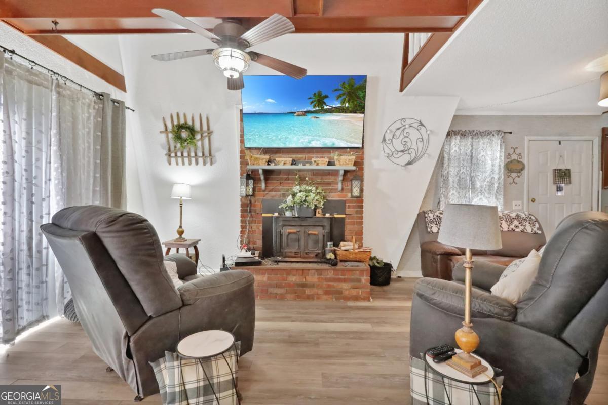2505 Odum Road South Screven, GA 31560 - Photo 33 of 55 a living room with furniture and a fireplace