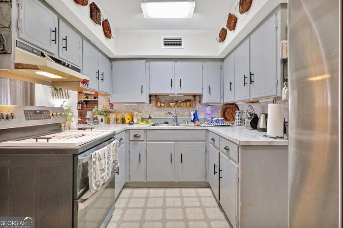 2505 Odum Road South Screven, GA 31560 - Photo 36 of 55 a kitchen with a sink window and cabinets