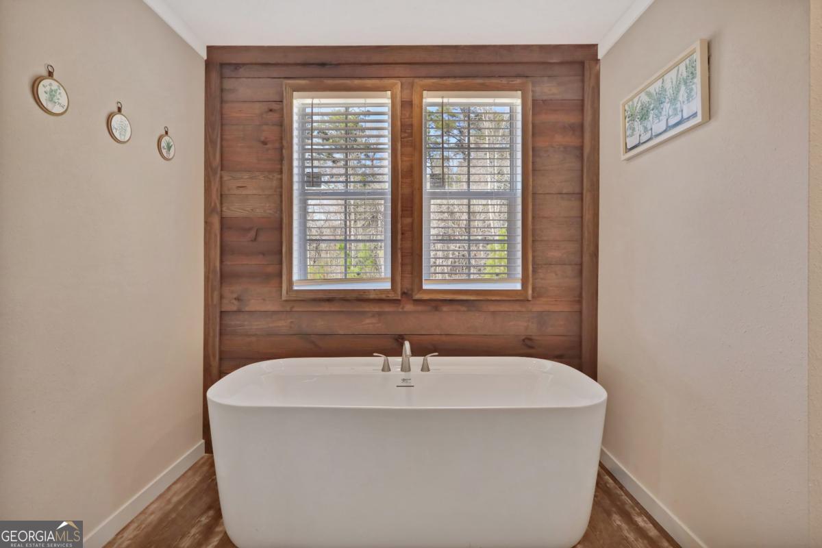 2505 Odum Road South Screven, GA 31560 - Photo 38 of 55 a bathroom with a bathtub and a window