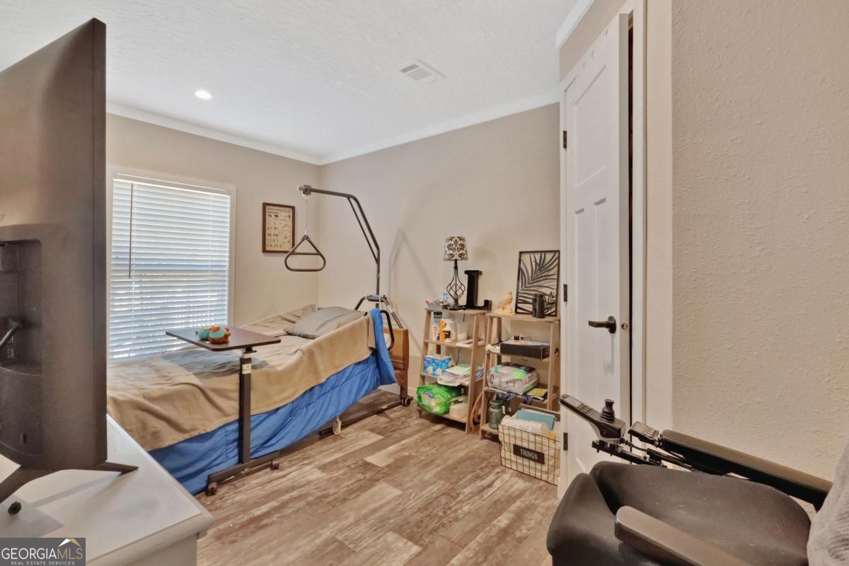 2505 Odum Road South Screven, GA 31560 - Photo 39 of 55 a bedroom with furniture and a window