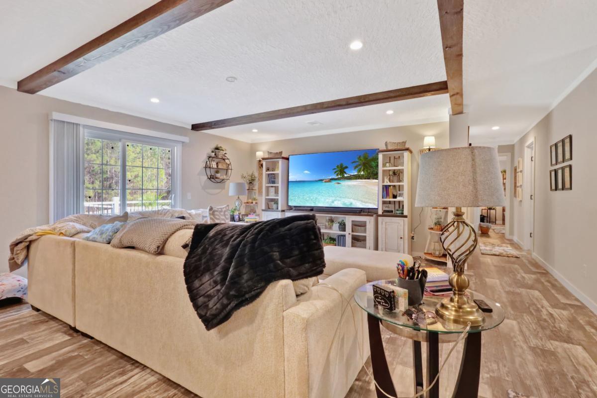 2505 Odum Road South Screven, GA 31560 - Photo 40 of 55 a bedroom with furniture and a large window