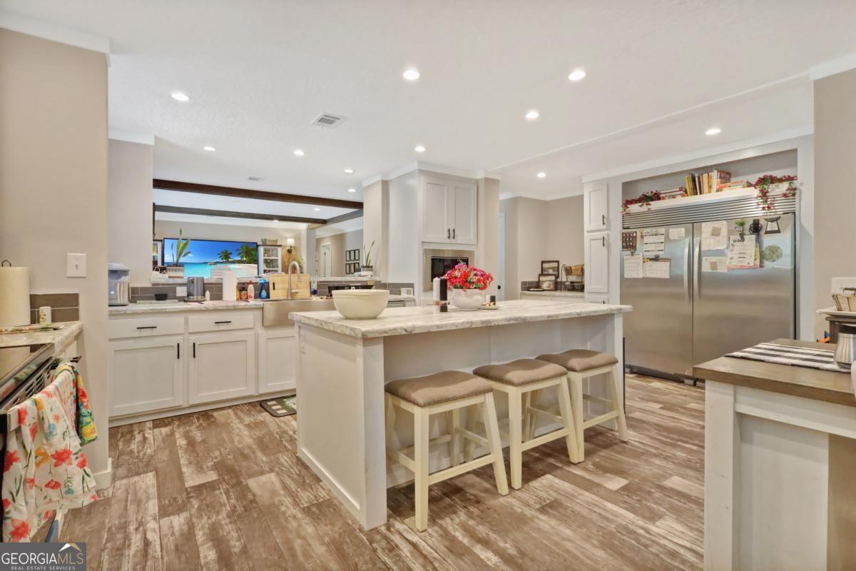 2505 Odum Road South Screven, GA 31560 - Photo 44 of 55 a kitchen with a sink cabinets and wooden floor