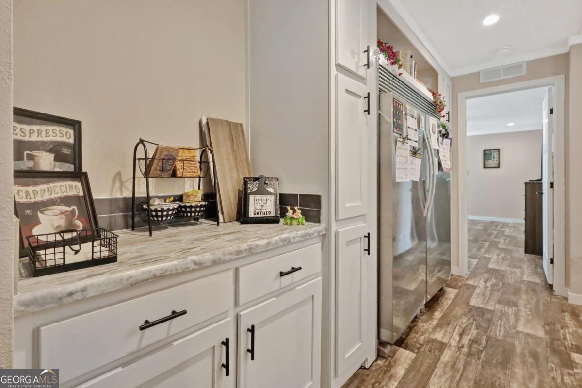 2505 Odum Road South Screven, GA 31560 - Photo 46 of 55 a spacious bathroom with a granite countertop sink and a mirror