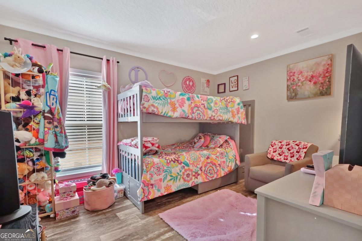 2505 Odum Road South Screven, GA 31560 - Photo 47 of 55 a bedroom with baby toys and decor