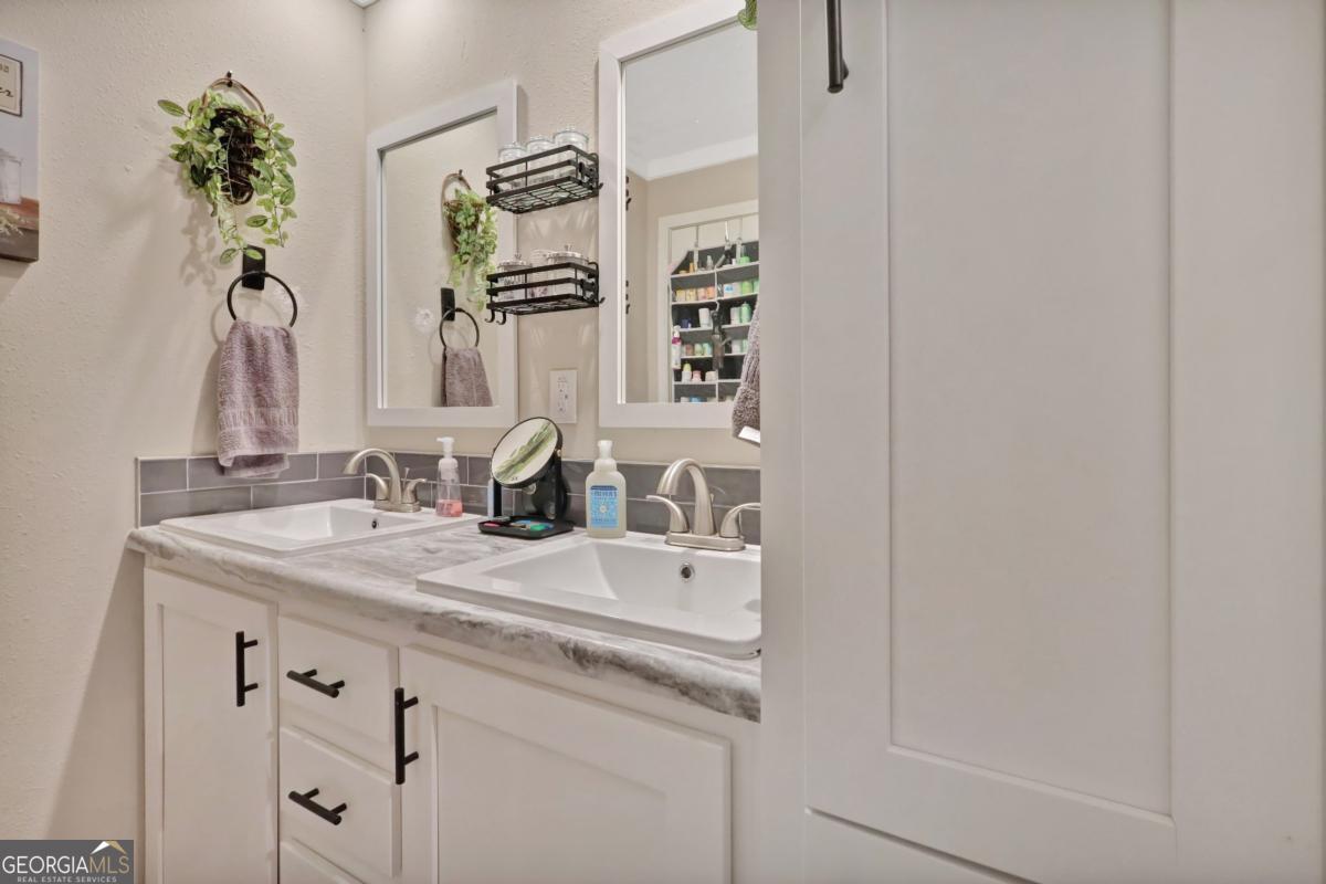 2505 Odum Road South Screven, GA 31560 - Photo 50 of 55 a bathroom with a sink and a mirror