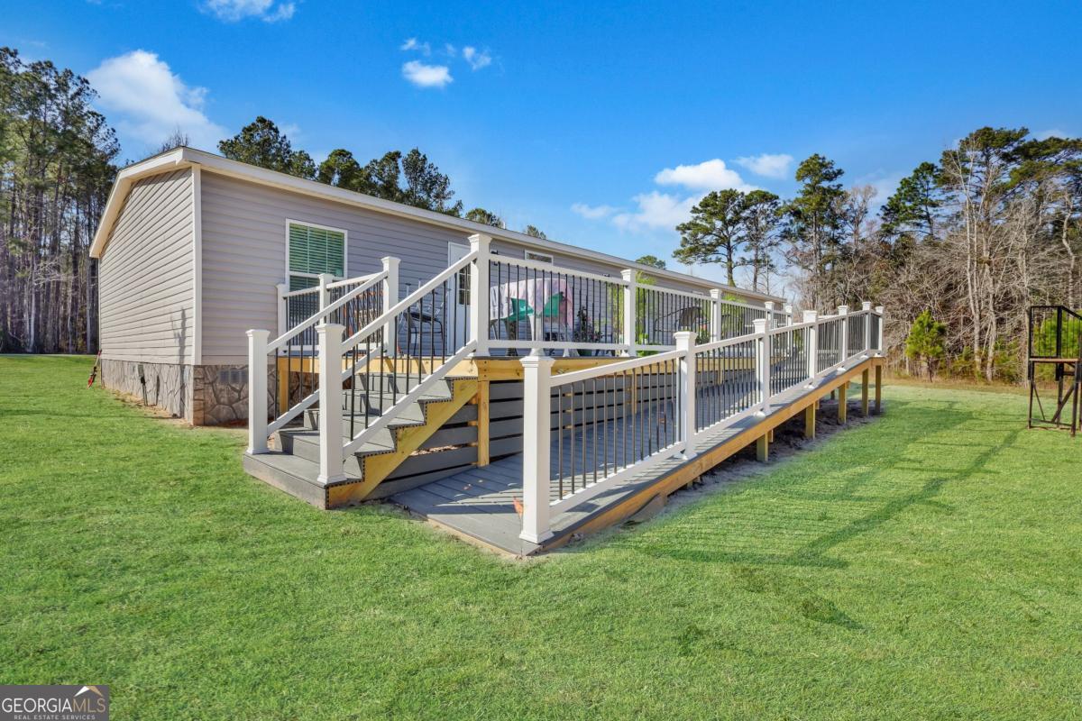 2505 Odum Road South Screven, GA 31560 - Photo 7 of 55 a view of a house with a yard and deck