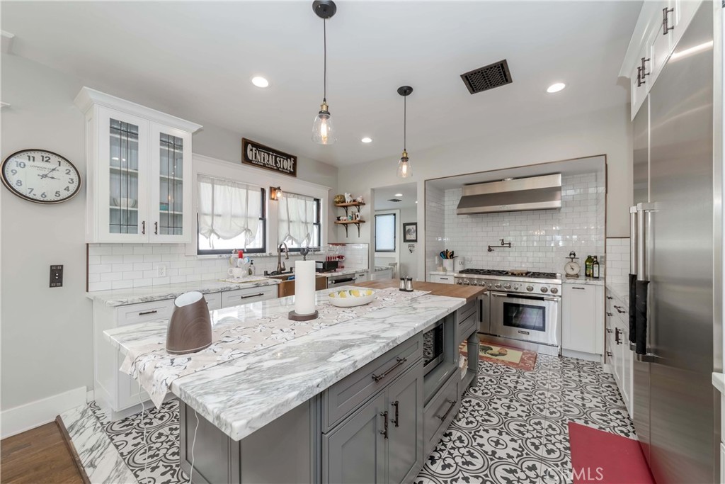 6554 Friends Avenue Whittier, CA 90601 - Photo 2 of 16 a kitchen with granite countertop a sink stove and refrigerator