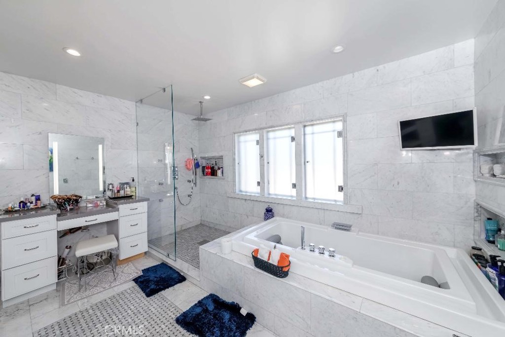 6554 Friends Avenue Whittier, CA 90601 - Photo 4 of 16 a bathroom with a tub a sink and a window