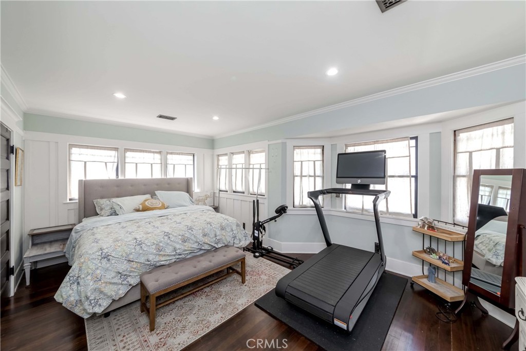 6554 Friends Avenue Whittier, CA 90601 - Photo 7 of 16 a bedroom with a bed a large window and furniture