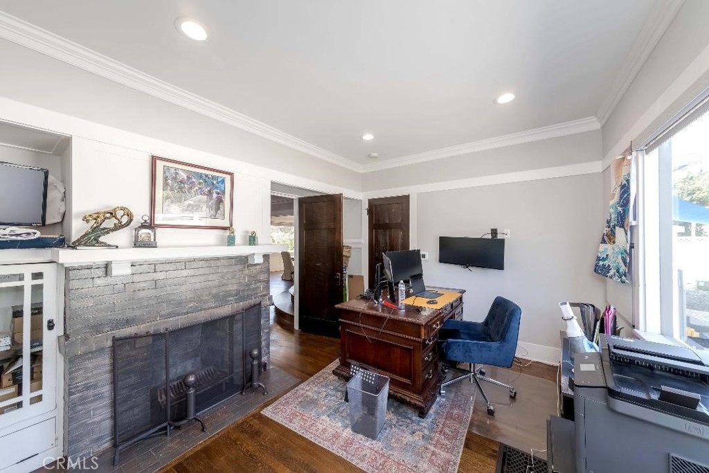 6554 Friends Avenue Whittier, CA 90601 - Photo 10 of 16 a living room with fireplace furniture and a flat screen tv