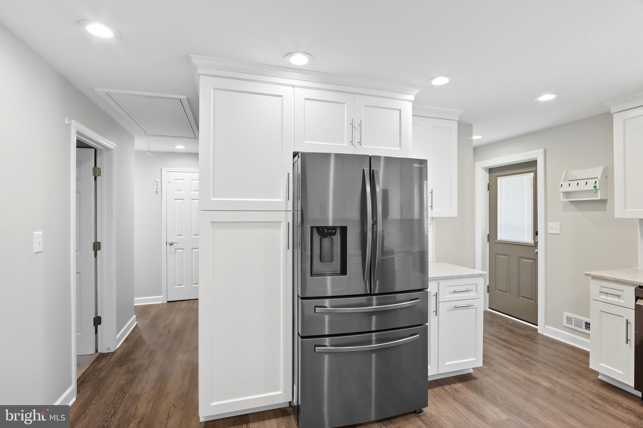 1206 Gettig Road Baltimore, MD 21237 - Photo 12 of 38 a metallic refrigerator freezer sitting in a kitchen