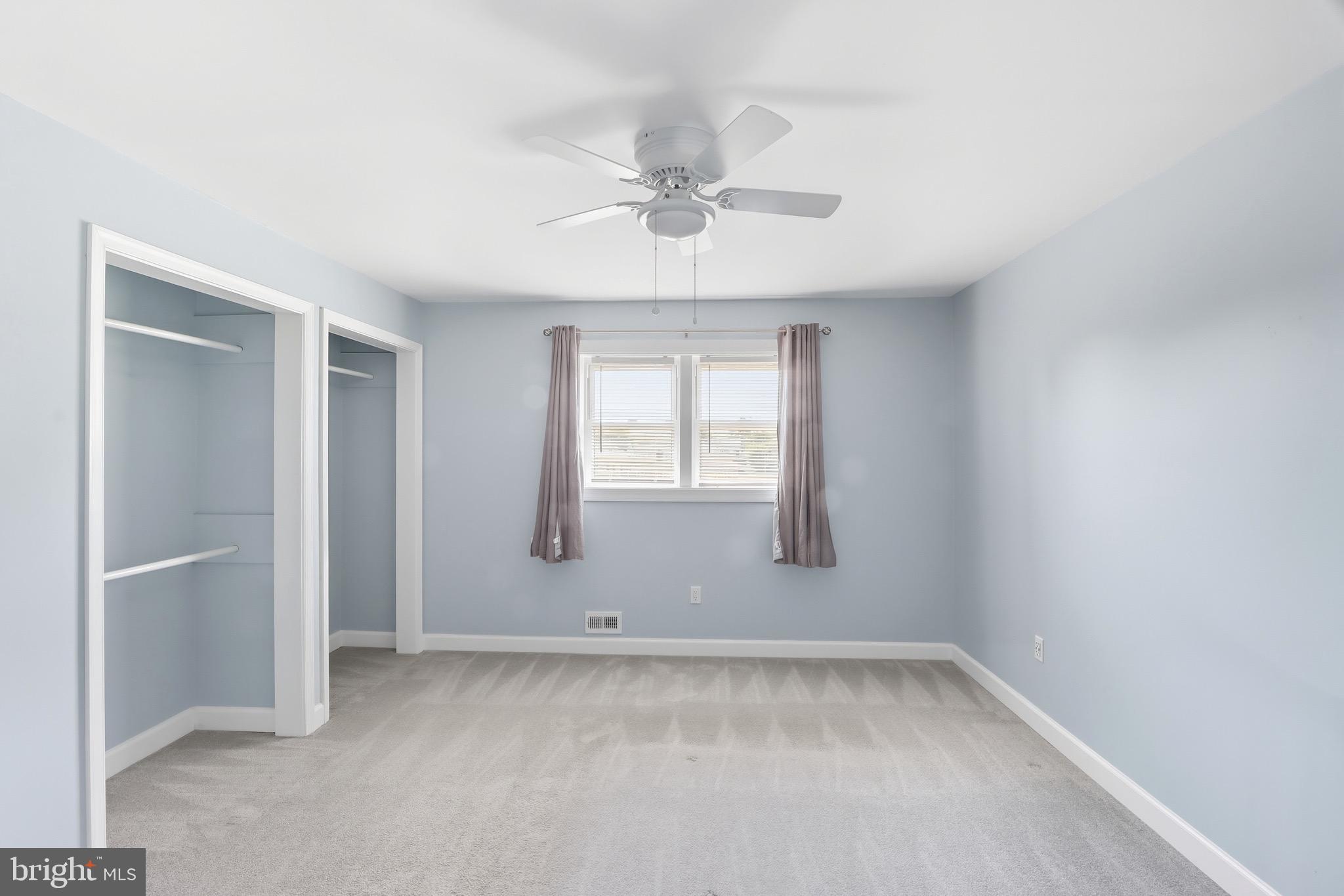 1206 Gettig Road Baltimore, MD 21237 - Photo 14 of 38 an empty room with a window and a fan