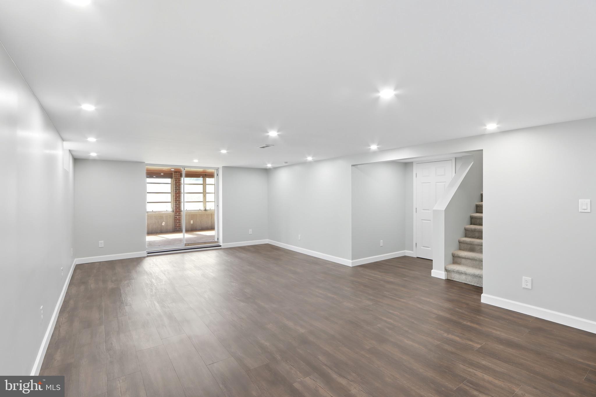 1206 Gettig Road Baltimore, MD 21237 - Photo 20 of 38 a view of an empty room with wooden floor and a window