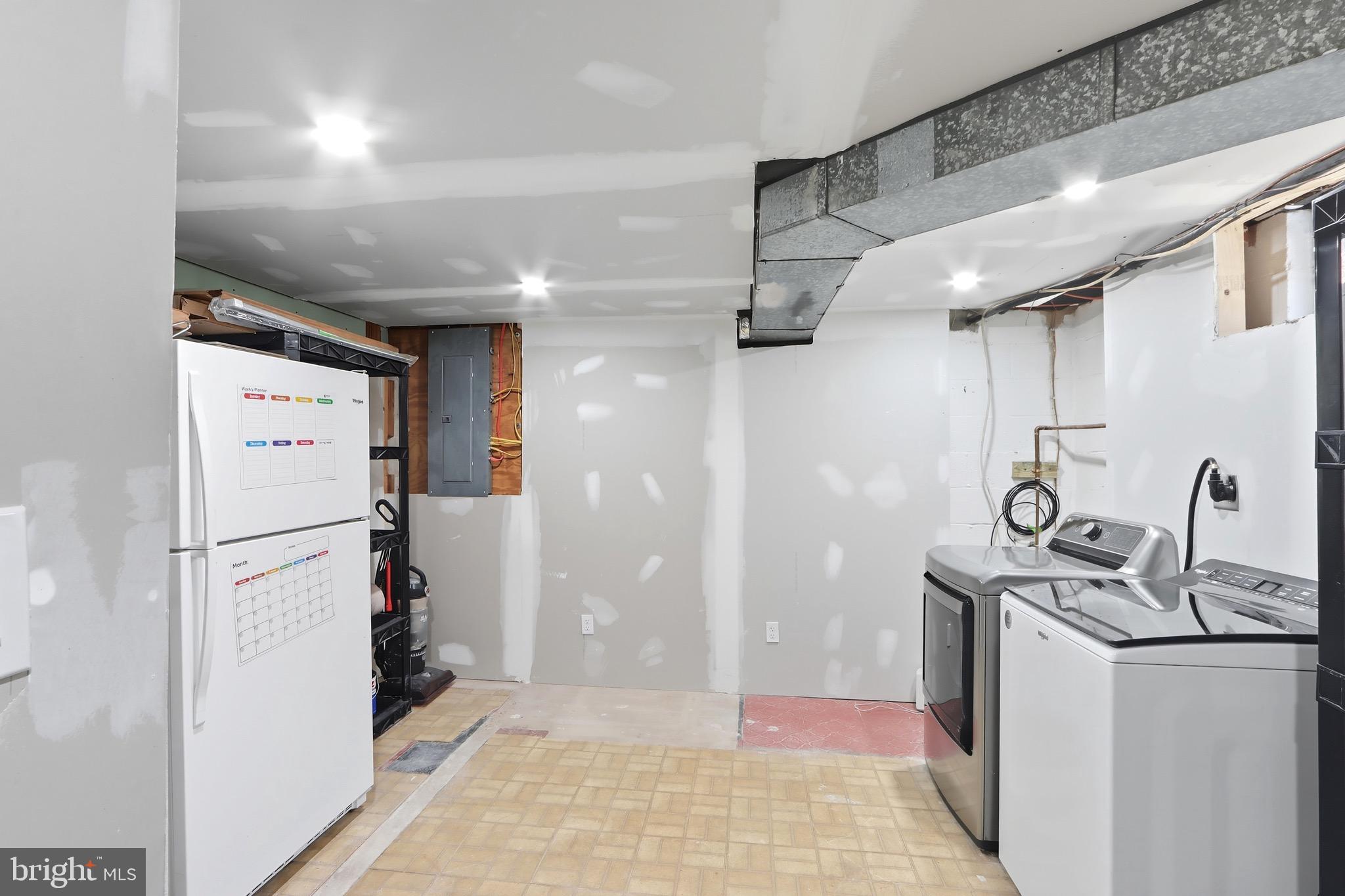 1206 Gettig Road Baltimore, MD 21237 - Photo 26 of 38 a kitchen with refrigerator a washer and dryer