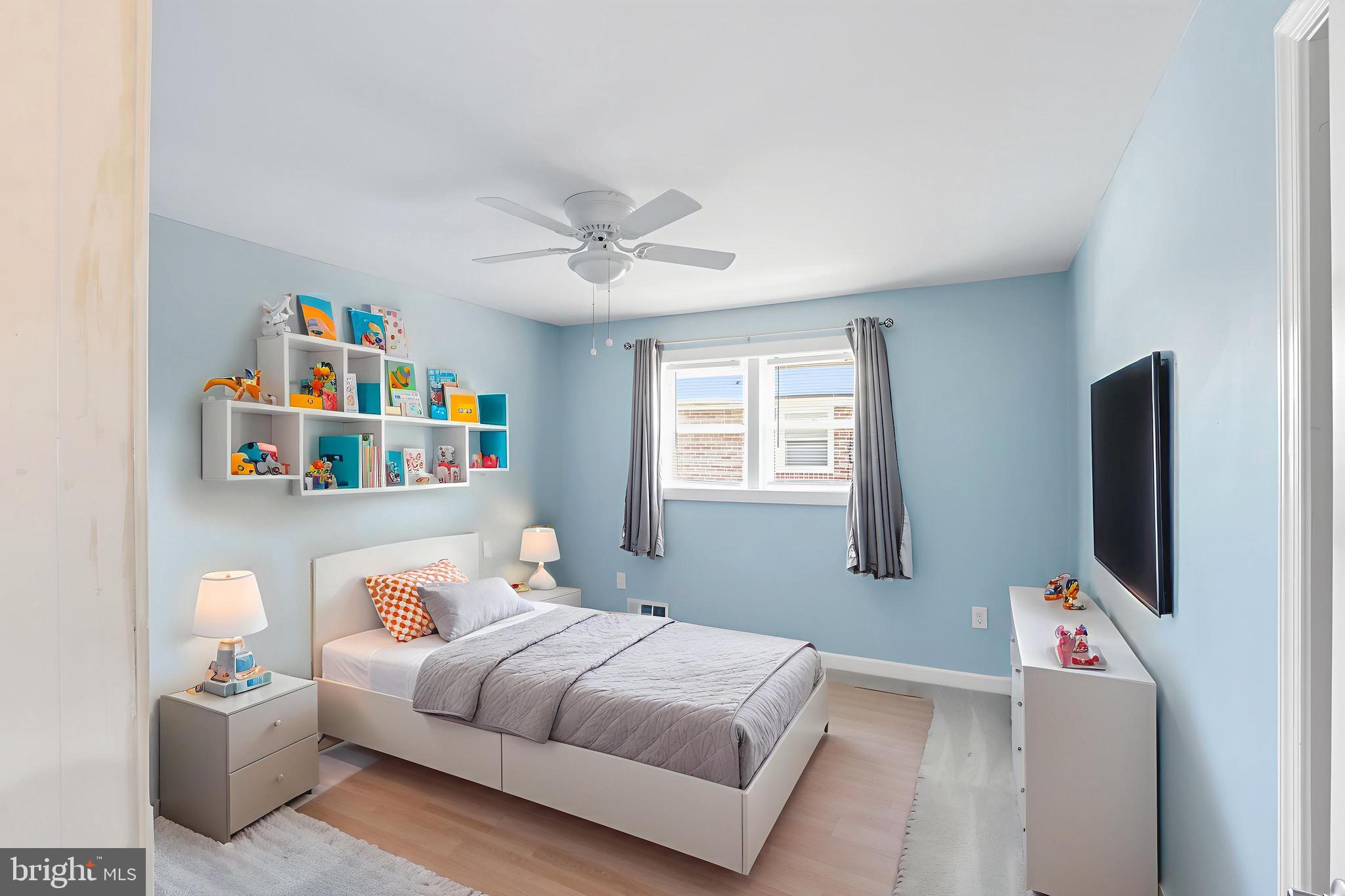 1206 Gettig Road Baltimore, MD 21237 - Photo 36 of 38 a bedroom with furniture and a flat screen tv