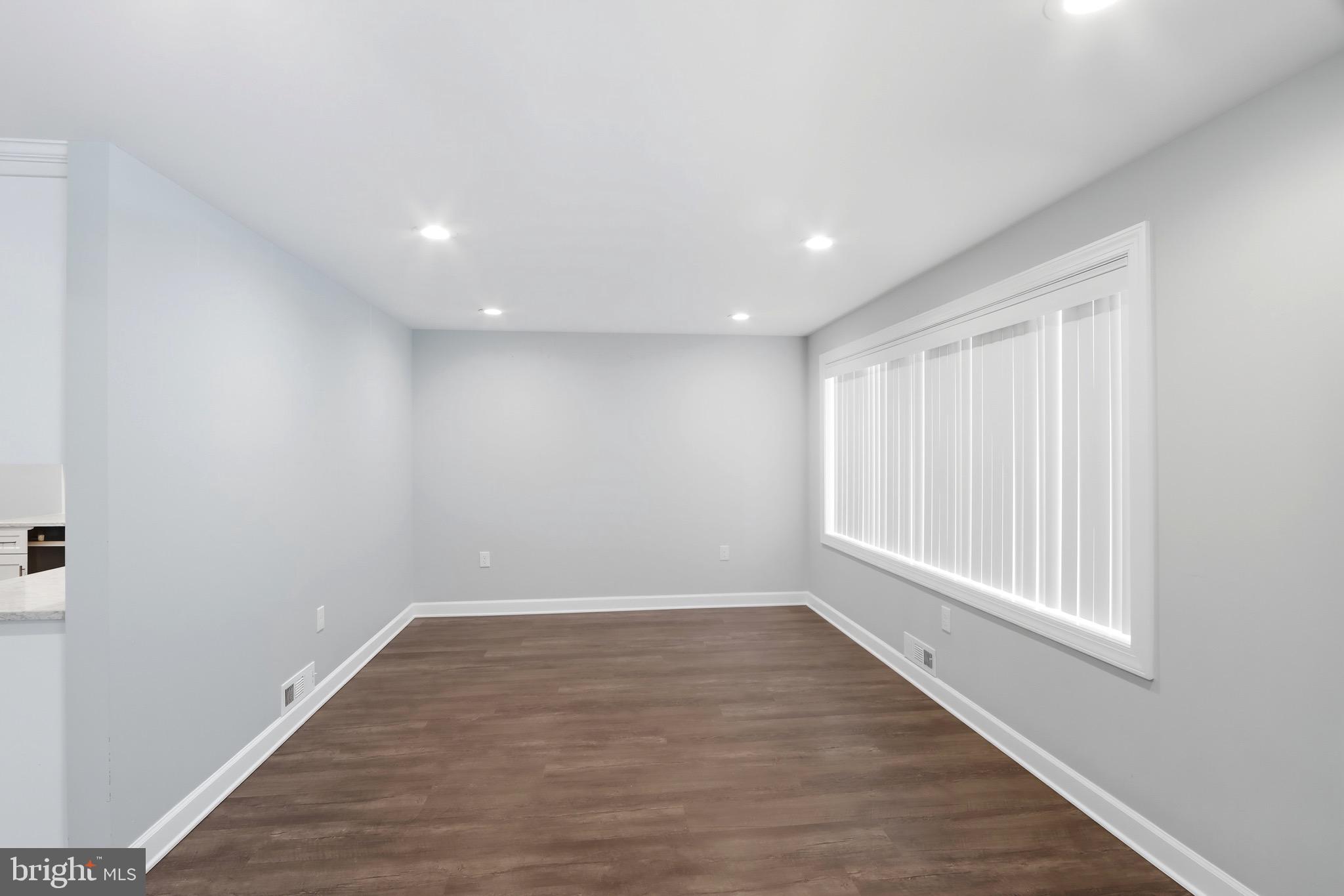 1206 Gettig Road Baltimore, MD 21237 - Photo 6 of 38 a view of a room with wooden floor and window