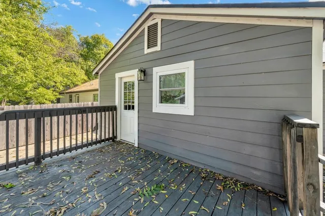 a front view of a house with a wooden fence