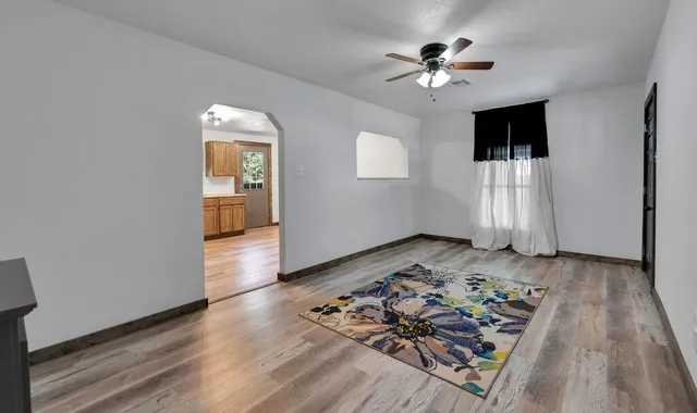 a view of a livingroom with wooden floor