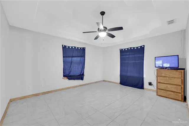 a view of an empty room and cabinet