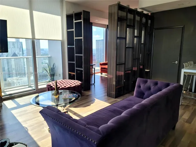 a living room with furniture and a rug