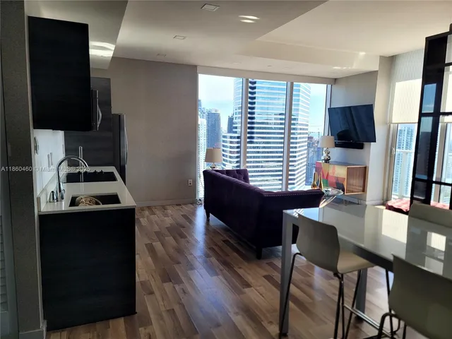 a room with furniture and a flat screen tv