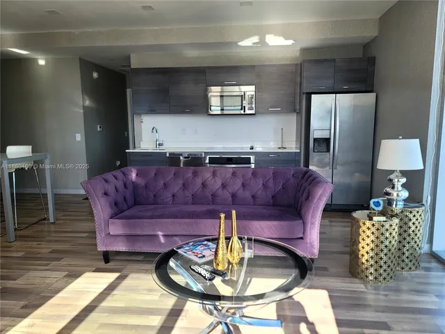 a living room with furniture and a table