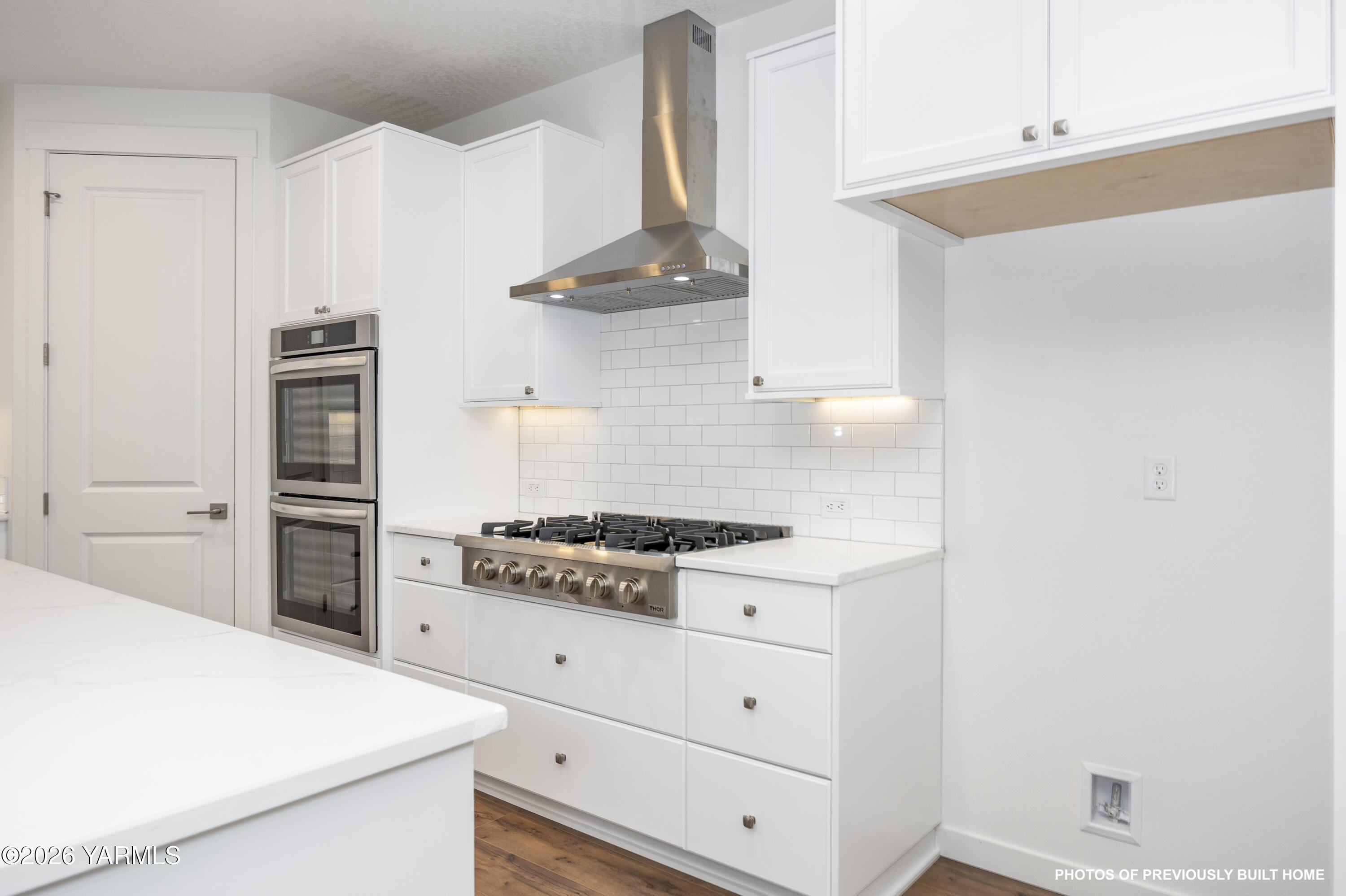 211 Packer Street Prosser, WA 99350 - Photo 24 of 31 a kitchen with a stove and a refrigerator