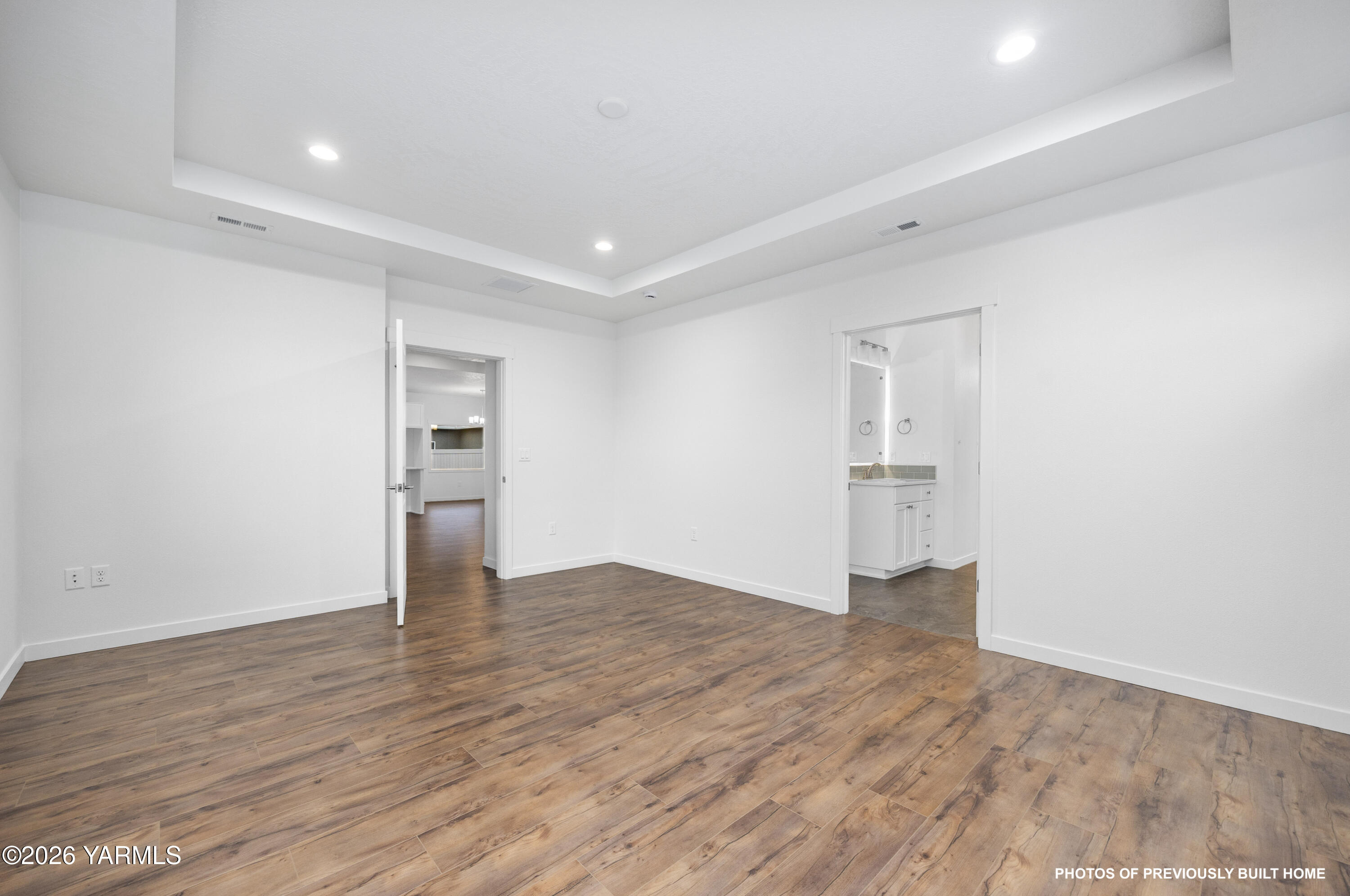 211 Packer Street Prosser, WA 99350 - Photo 27 of 31 a view of an empty room with wooden floor